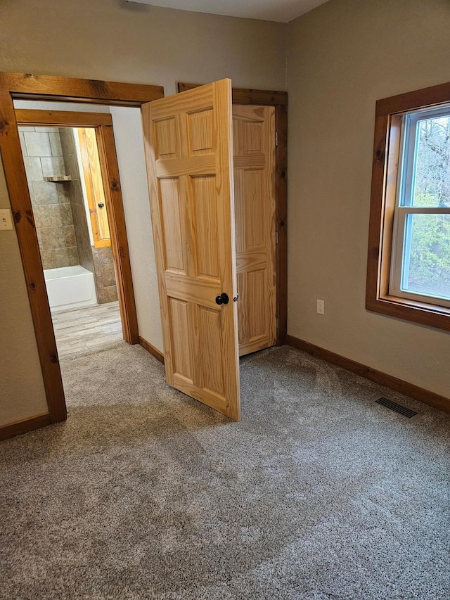 unfurnished bedroom featuring carpet floors