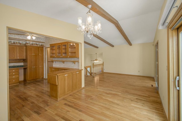 kitchen with pendant lighting, vaulted ceiling with beams, ceiling fan, and light wood-type flooring