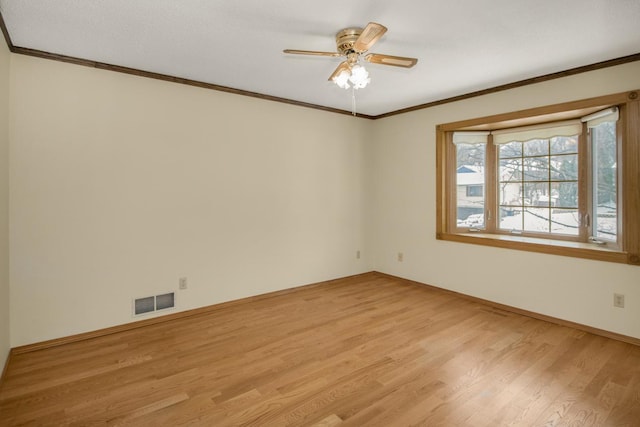 unfurnished room featuring ceiling fan, ornamental molding, and light hardwood / wood-style flooring