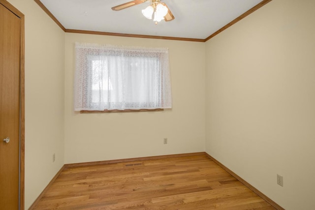 spare room with ceiling fan, ornamental molding, and light hardwood / wood-style floors