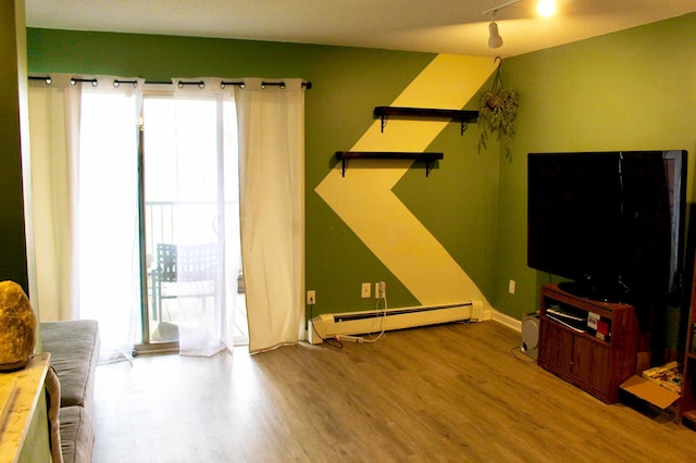 living room with hardwood / wood-style floors and a baseboard radiator