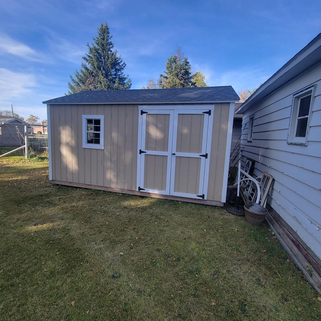 view of outdoor structure with a lawn