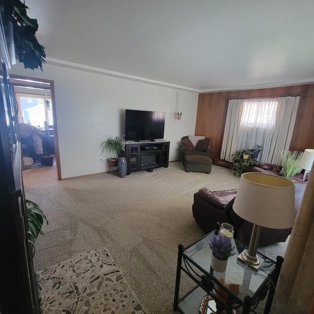 carpeted living room with crown molding