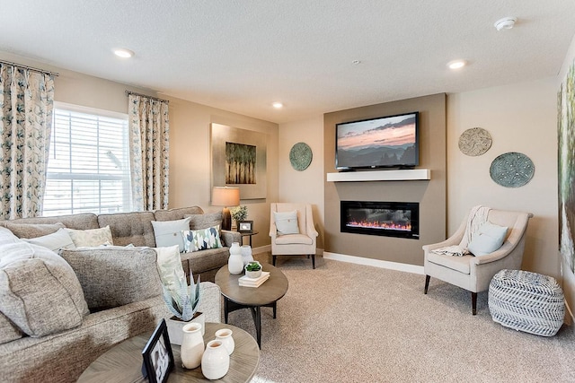 carpeted living room featuring a textured ceiling