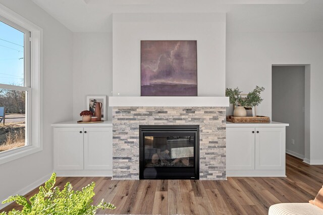 371 Liberty Dr, Hanover, MN 55341 - living area with baseboards, a fireplace, and light wood-style flooring