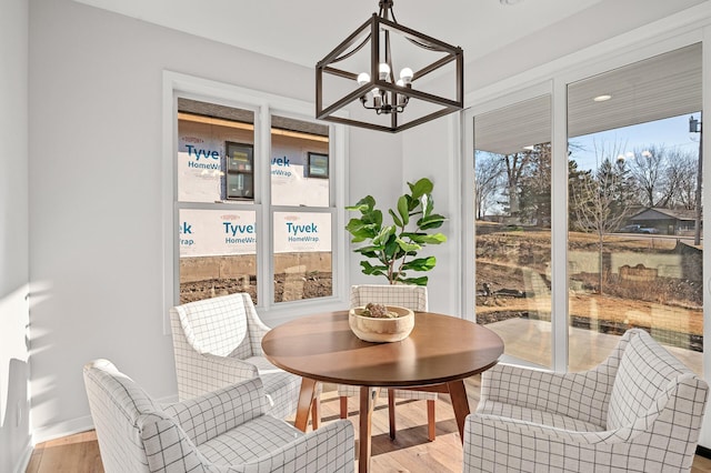 sunroom with an inviting chandelier