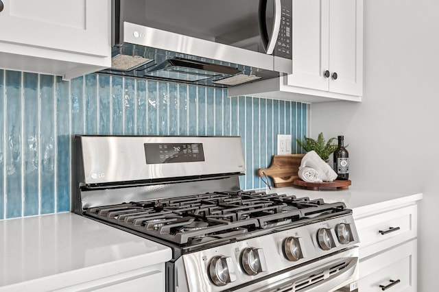 kitchen with white cabinetry and stainless steel appliances