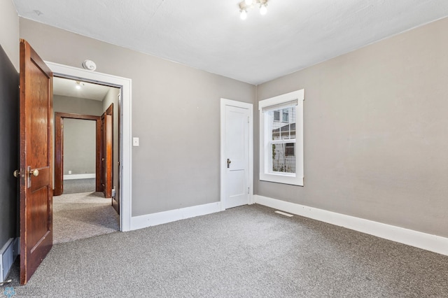 spare room featuring carpet flooring