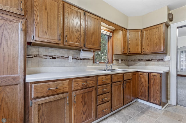 kitchen featuring backsplash and sink