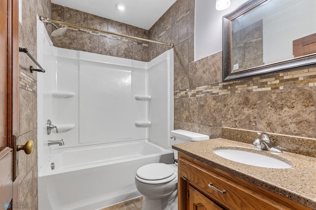 full bathroom featuring shower / bathtub combination, vanity, tile walls, and toilet