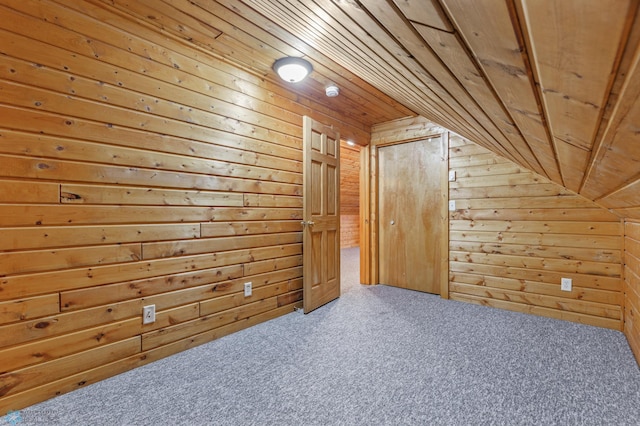 bonus room with carpet, vaulted ceiling, wood ceiling, and wood walls