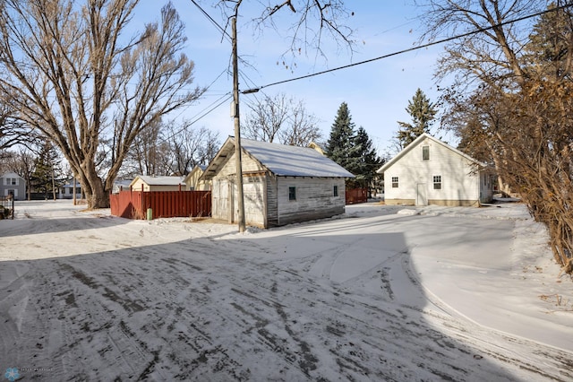 view of front facade featuring an outbuilding and a garage