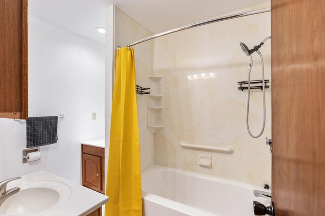 bathroom with shower / tub combo with curtain and vanity