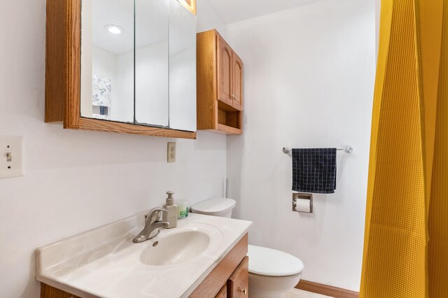 bathroom with vanity and toilet