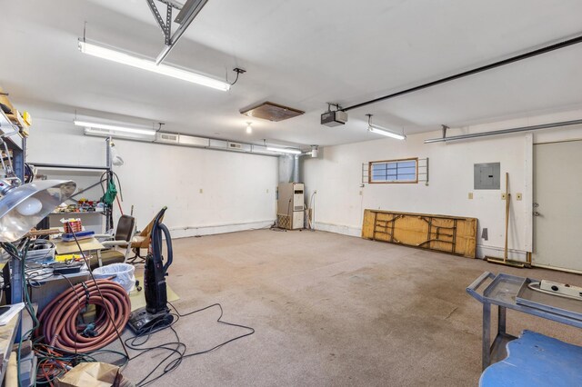 garage with electric panel and a garage door opener