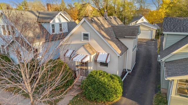 view of front facade featuring a garage and an outdoor structure