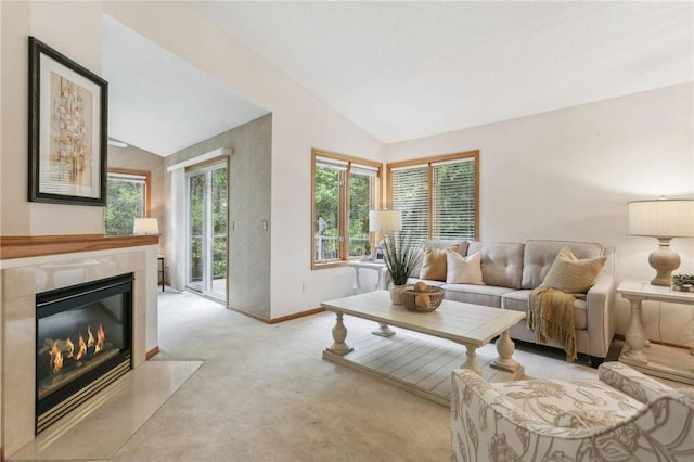 living room with vaulted ceiling and light colored carpet