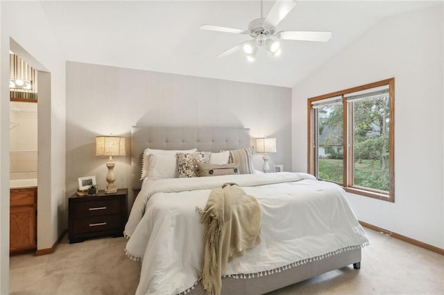 bedroom featuring light colored carpet, lofted ceiling, and ceiling fan