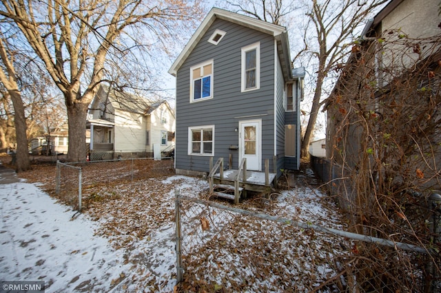 view of snow covered house