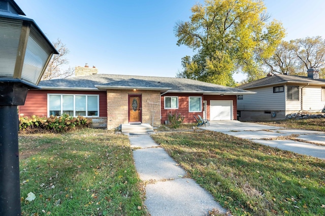 view of front of house with a garage and a front yard