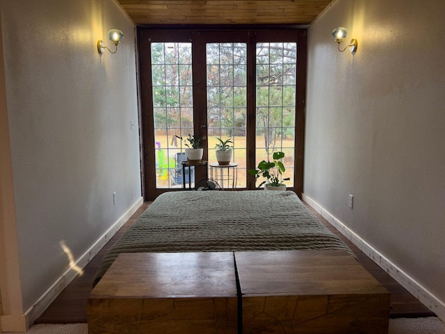 interior space with french doors and wooden ceiling