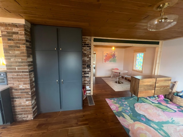 bedroom with dark hardwood / wood-style floors