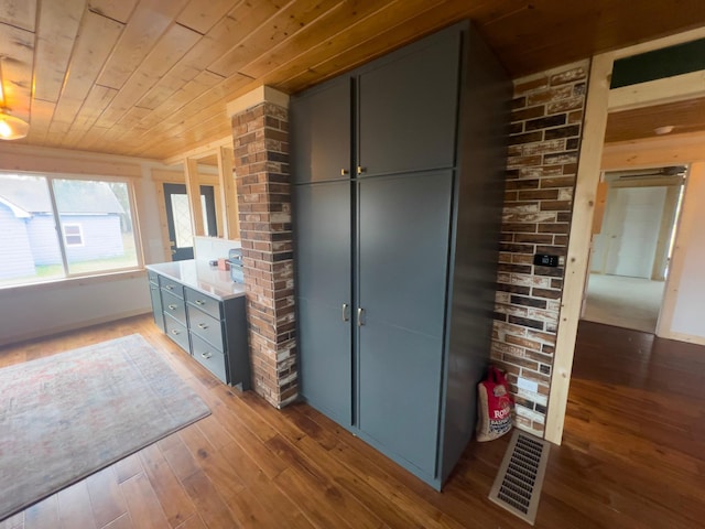 interior space featuring light hardwood / wood-style flooring and wood ceiling