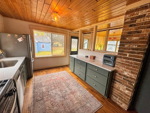 kitchen featuring light hardwood / wood-style floors, wood ceiling, decorative light fixtures, and appliances with stainless steel finishes