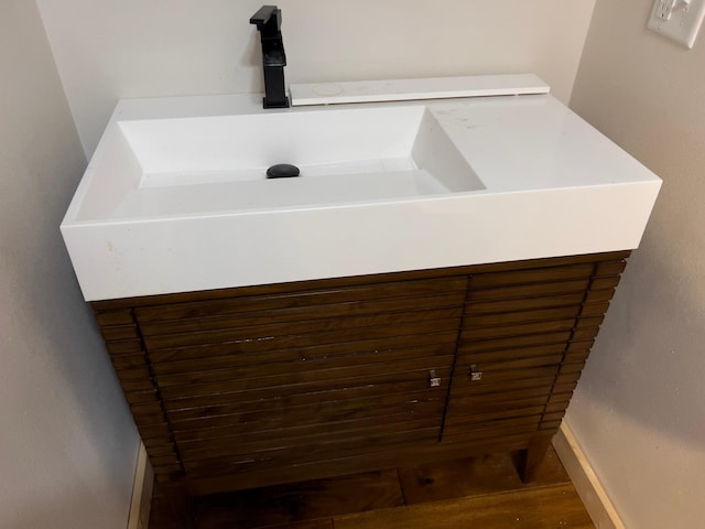 bathroom featuring hardwood / wood-style floors and sink