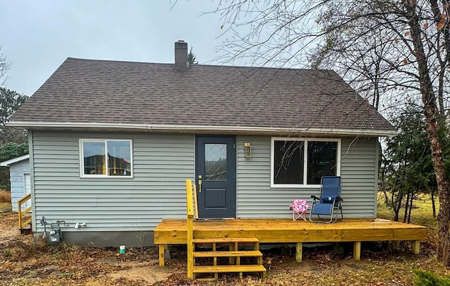 back of property featuring a deck