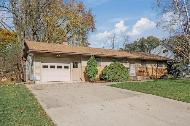 ranch-style home with a front lawn and a garage