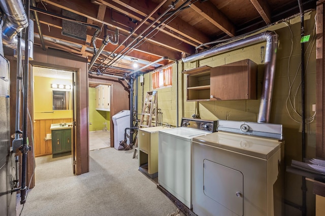 basement with light carpet and separate washer and dryer