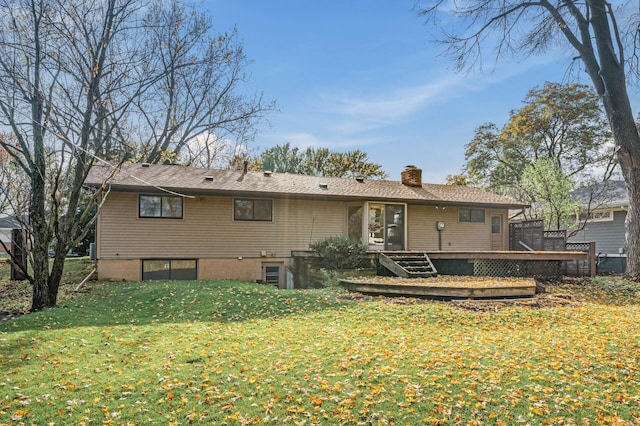 back of house featuring a deck and a yard