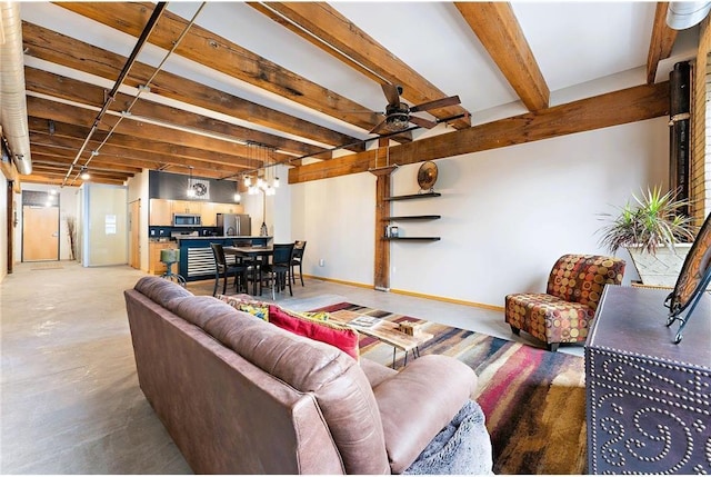 living room featuring beamed ceiling, concrete floors, and ceiling fan