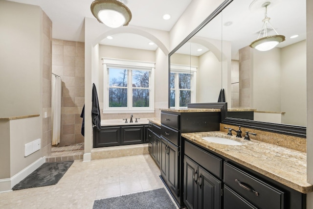 bathroom featuring vanity, tile patterned floors, and shower with separate bathtub