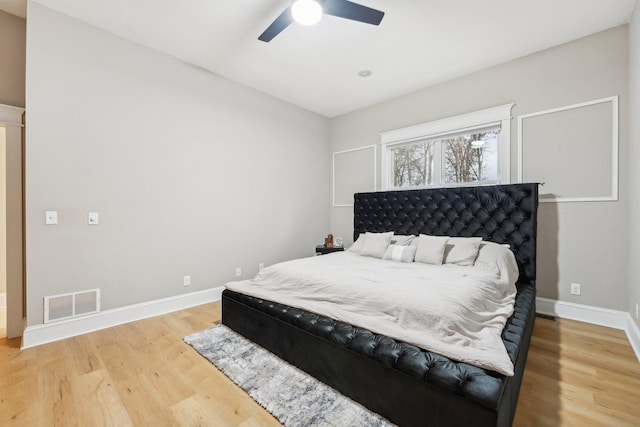 bedroom featuring wood-type flooring and ceiling fan