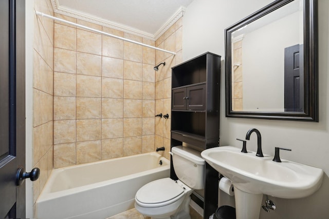 full bathroom with toilet, tiled shower / bath combo, a textured ceiling, sink, and crown molding