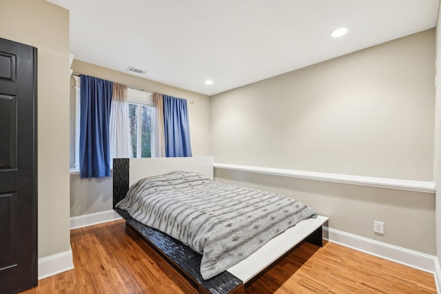 bedroom featuring hardwood / wood-style floors