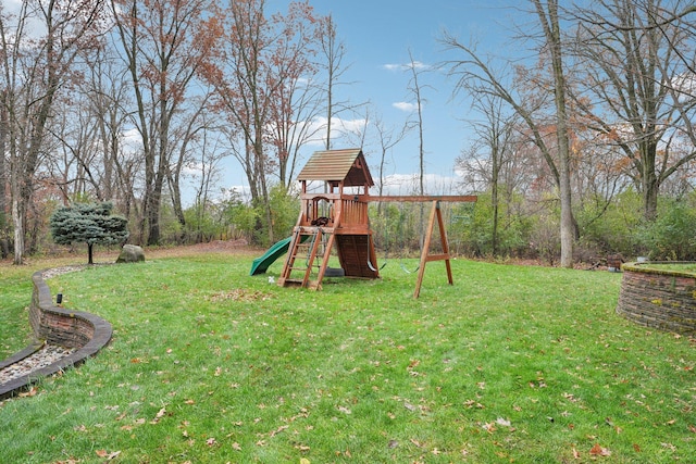 view of jungle gym with a lawn