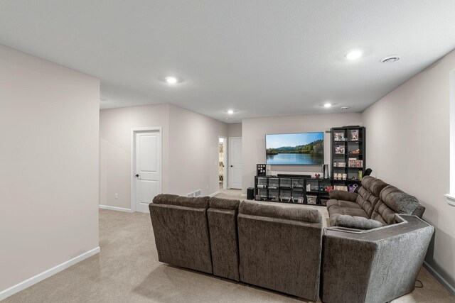 living area with baseboards, light carpet, recessed lighting, and visible vents