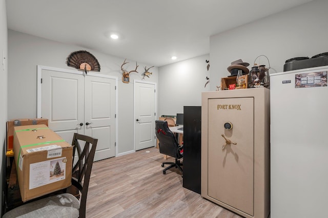office area with light wood-type flooring and recessed lighting