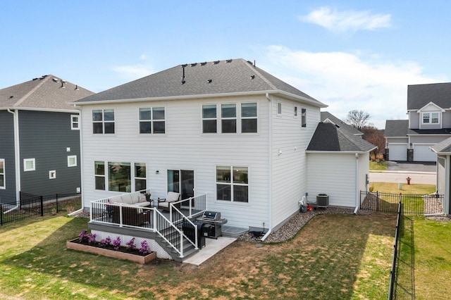 rear view of house with an outdoor living space, cooling unit, a fenced backyard, a yard, and a shingled roof