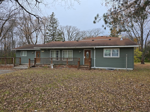 ranch-style home with a deck