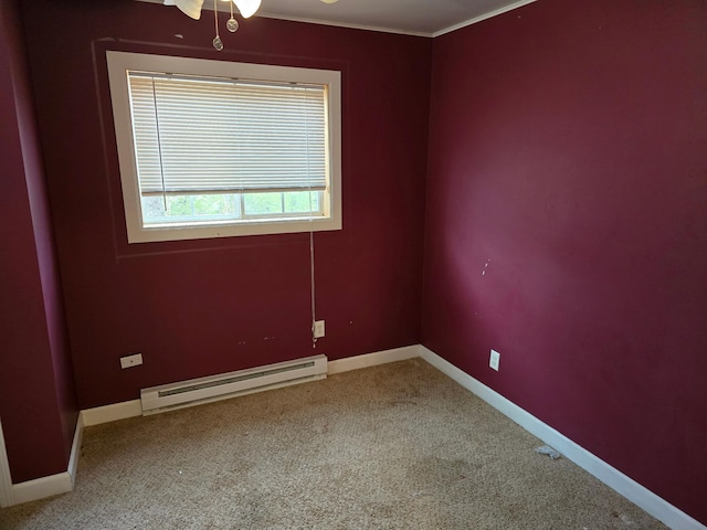 unfurnished room with crown molding, baseboards, baseboard heating, and carpet floors
