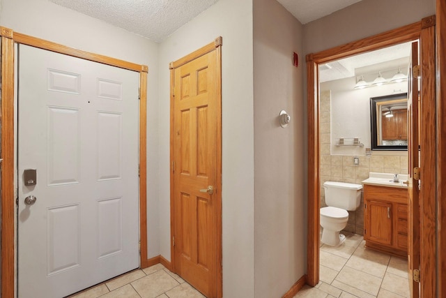 interior space with sink and a textured ceiling