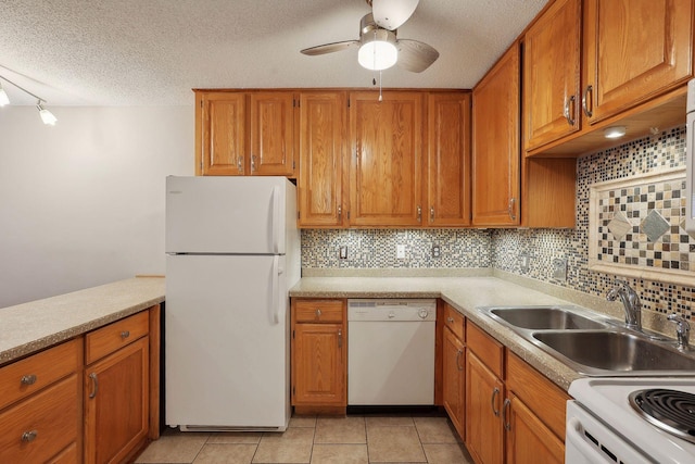 kitchen with a textured ceiling, ceiling fan, light tile patterned floors, and white appliances