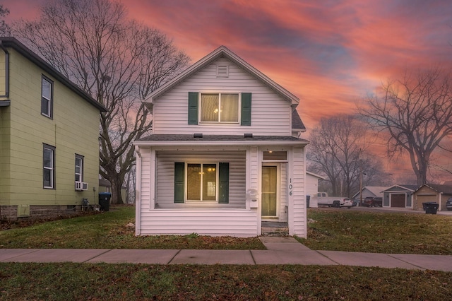 front facade with a yard and a porch