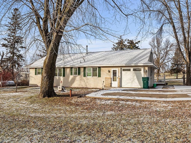 ranch-style home featuring a garage