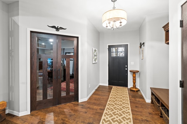 foyer featuring dark hardwood / wood-style floors and a notable chandelier