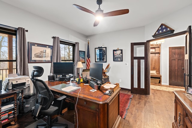 office area featuring light hardwood / wood-style flooring and ceiling fan